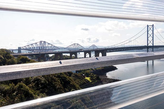 Photograph shows the view from the Queensferry Crossing of the Forth Road & Rail bridges