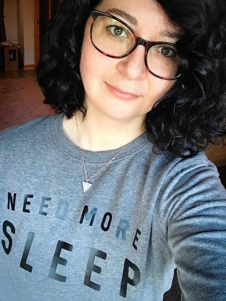 Me wearing my need more sleep sweater.