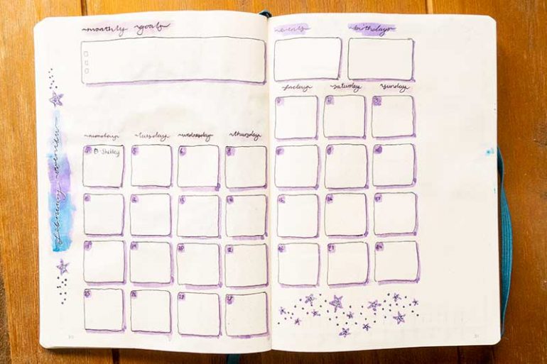 My monthly overview spread for February in my bullet journal shows a calendar overview and boxes for my monthly goals, events and birthdays.