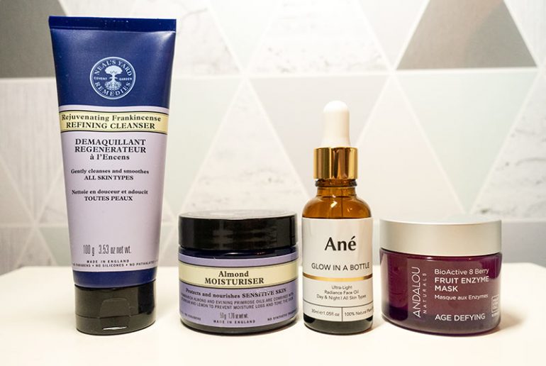 Photograph shows 4 products. From left to right: Neal's Yard Rejuvenating Frankincense cleanser, Neal's yard almond moisturiser, Glow in a bottle by Beauty by Ane and Andalou Naturals enzyme berry mask.