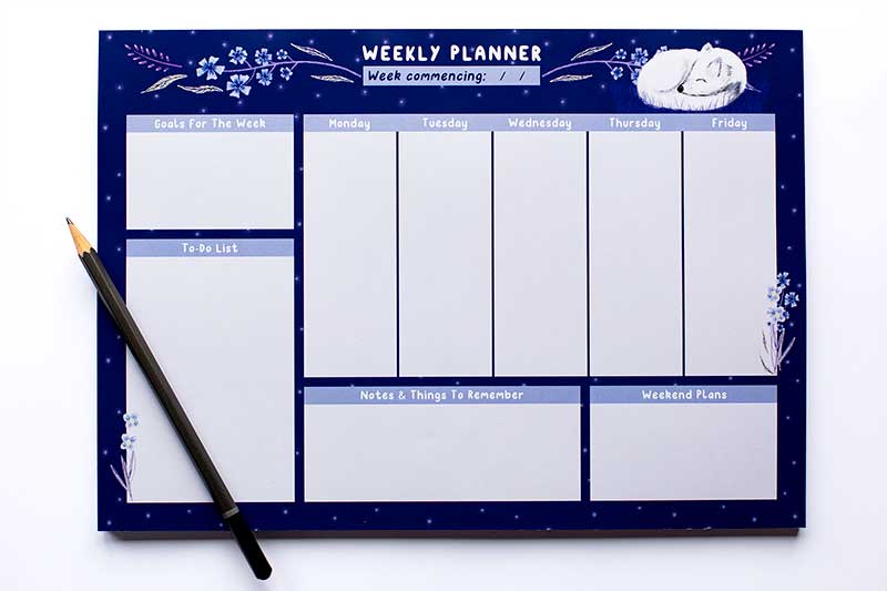 Flay lay of my Arctic Fox A4 Weekly Desktop Planner with a pencil lying across the bottom left corner.