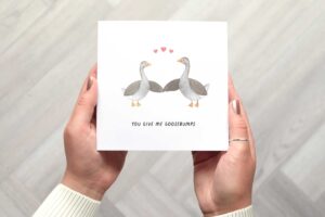 Photo shows the you give me goosebumps card being held.