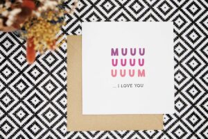 A cute card for Mum that reads muuuuuuum... I love you. Mum is in a purple to pink all-caps font. And I love you is in a black all-caps font.