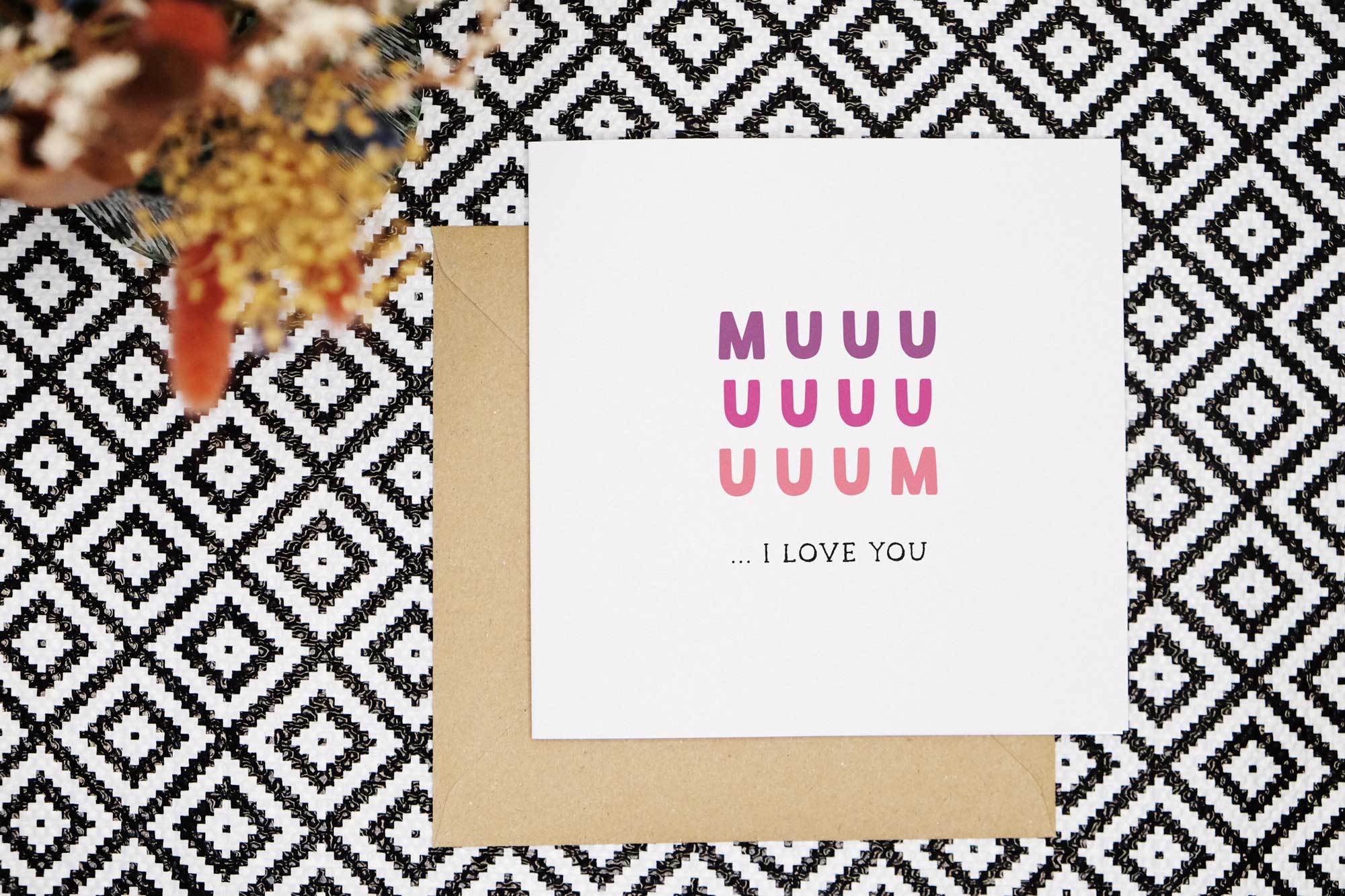 A cute card for Mum that reads muuuuuuum... I love you. Mum is in a purple to pink all-caps font. And I love you is in a black all-caps font.
