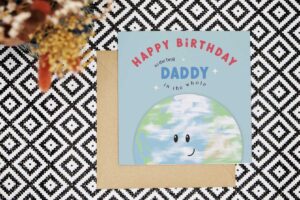 A playful and fun card with a blue background that reads Happy Birthday to the best Daddy in the whole and underneath the text there is an illustration of the planet earth with a smiling face.